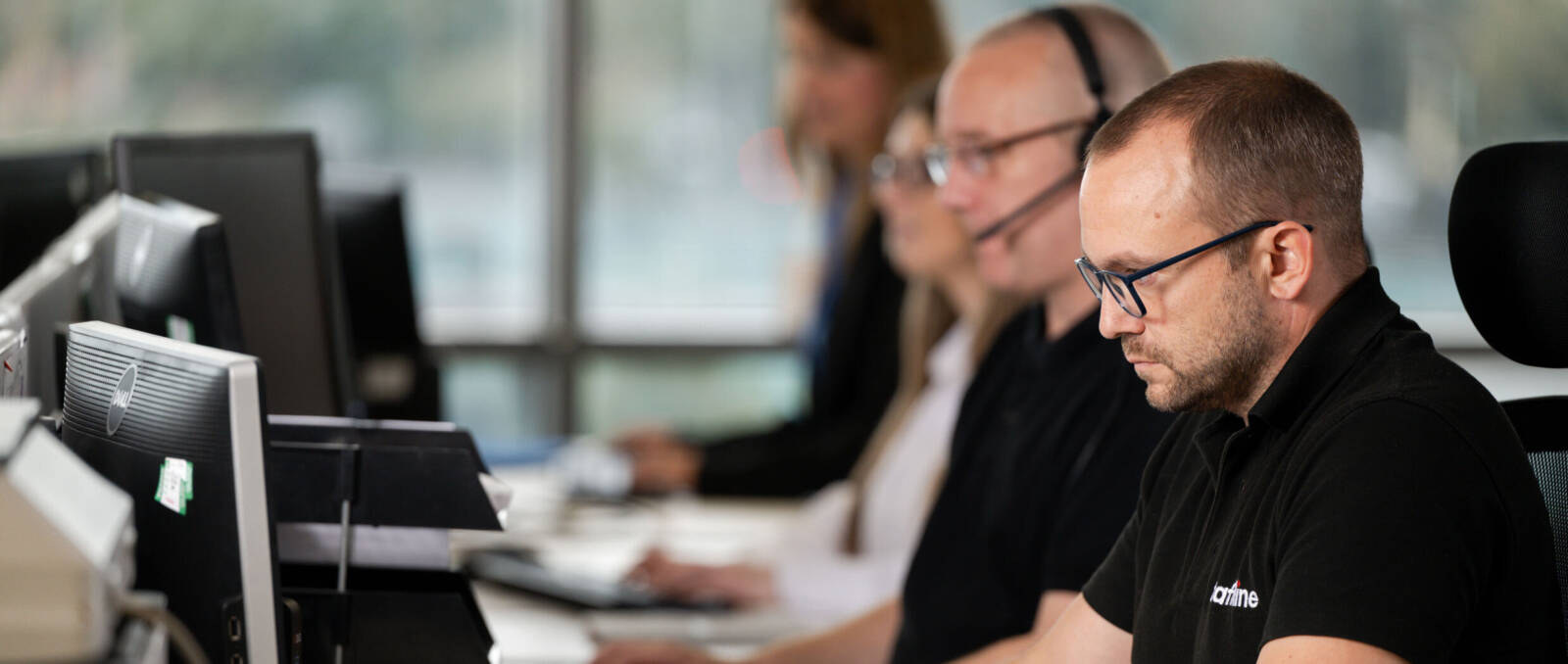 Staffline team members working at their computers