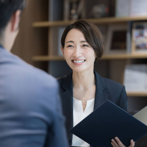 Two people talking and smiling